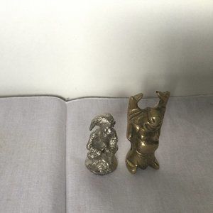 two metal miniature figurines one copper one silvertone